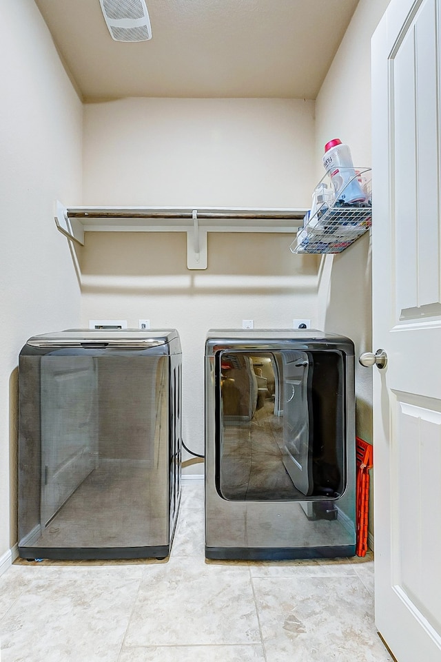 laundry area with separate washer and dryer