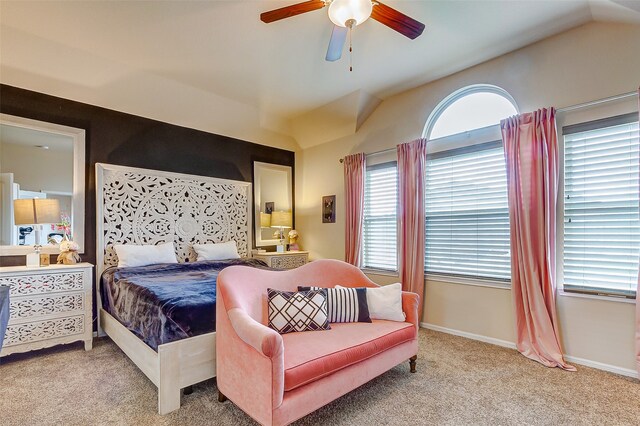 carpeted bedroom featuring lofted ceiling and ceiling fan