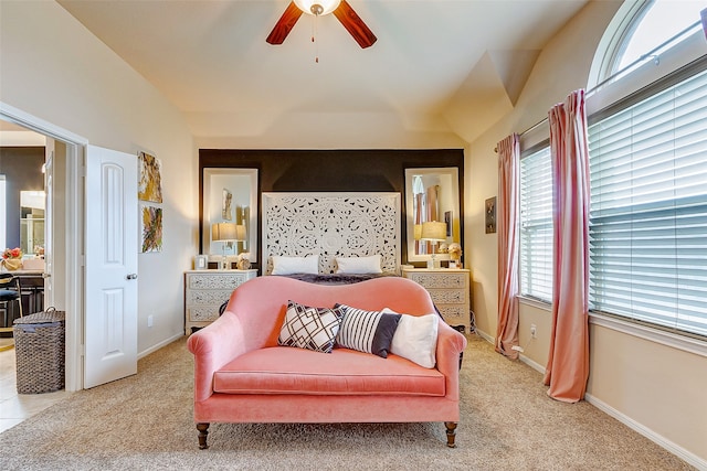 bedroom featuring lofted ceiling, light colored carpet, and ceiling fan