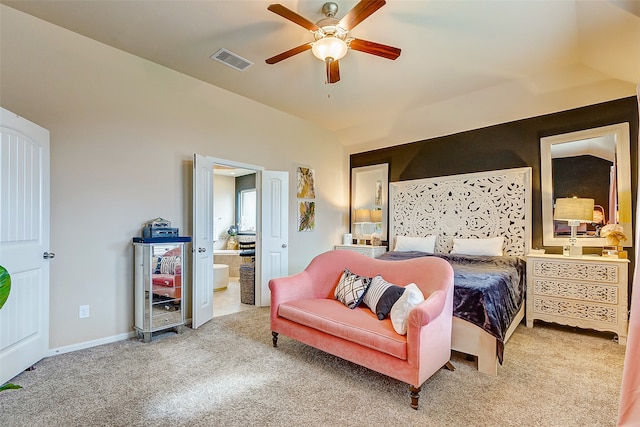 bedroom with ensuite bath, ceiling fan, and light colored carpet