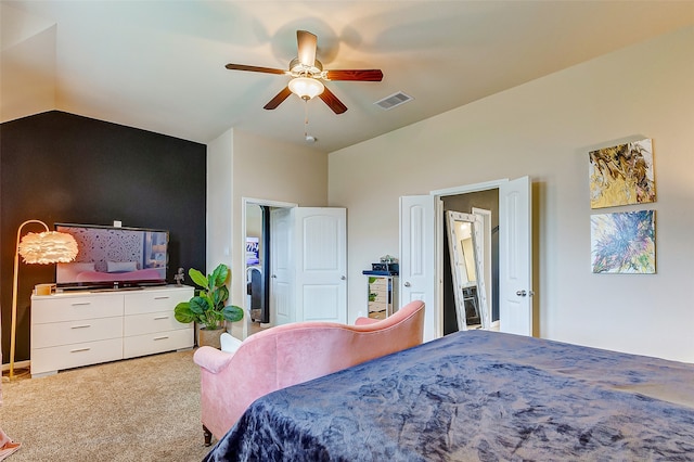 bedroom with vaulted ceiling, ceiling fan, and carpet floors