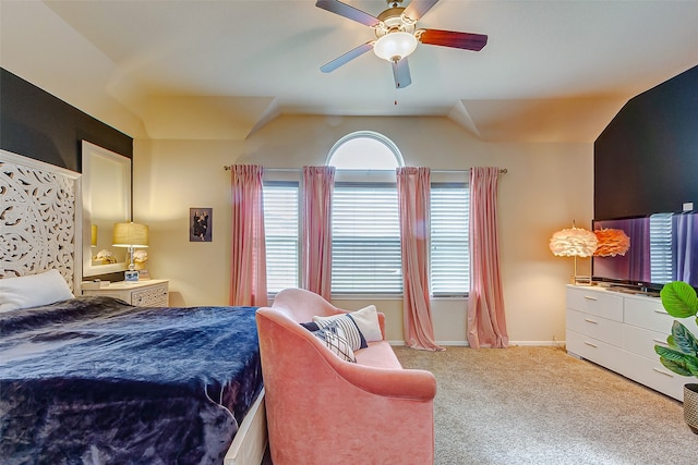 carpeted bedroom with lofted ceiling and ceiling fan