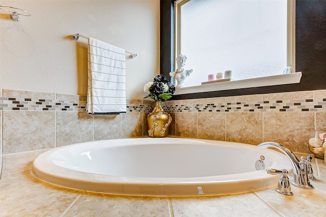 bathroom with a tub to relax in