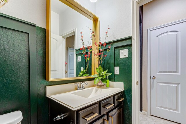 3614 Daintree Park Dr, Katy, TX 77494 - bathroom with vanity, toilet, tile patterned floors, and a textured wall