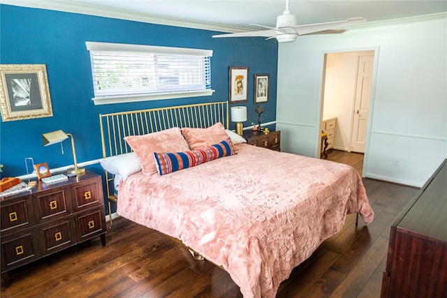 bedroom featuring dark hardwood / wood-style floors, ceiling fan, and crown molding