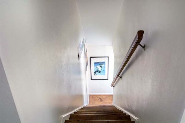 staircase with hardwood / wood-style flooring