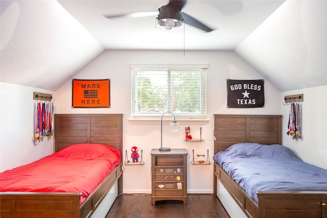 bedroom with ceiling fan, dark wood-type flooring, and lofted ceiling