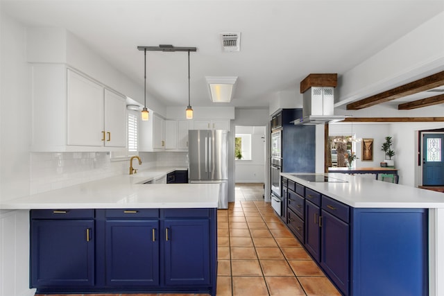 kitchen featuring blue cabinetry, island exhaust hood, white cabinetry, and stainless steel appliances