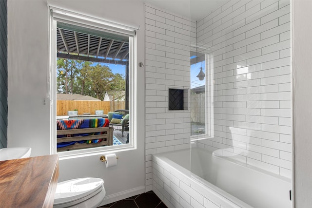 bathroom featuring tile patterned flooring, toilet, and independent shower and bath