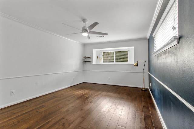 unfurnished room with dark hardwood / wood-style floors, a wealth of natural light, ornamental molding, and ceiling fan