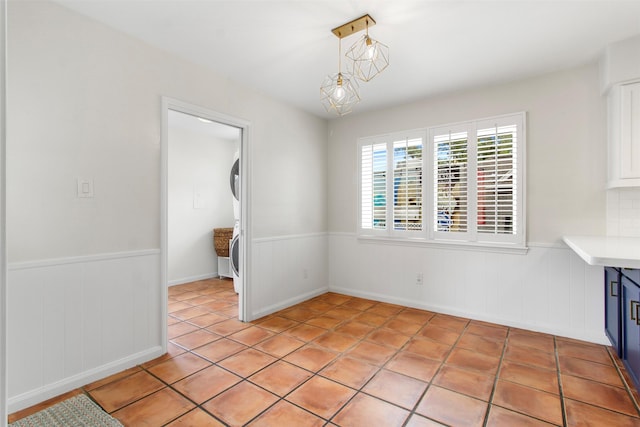 unfurnished dining area with light tile patterned floors