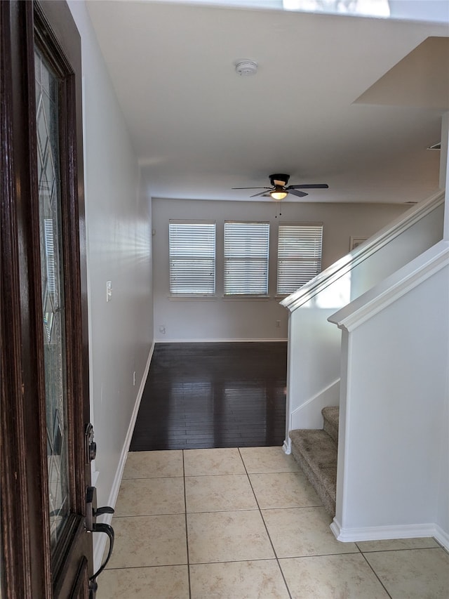 foyer entrance with light hardwood / wood-style floors and ceiling fan