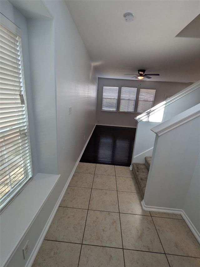 corridor with light tile patterned flooring