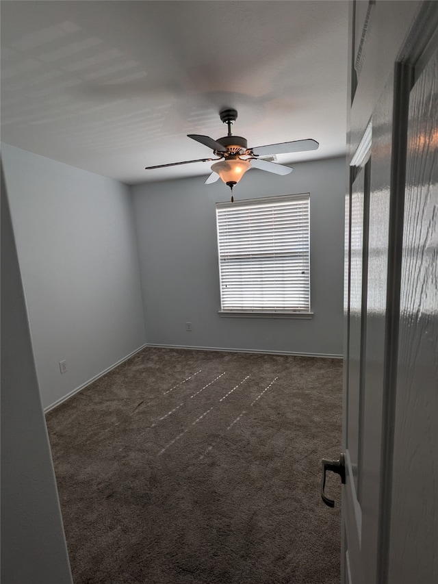 carpeted empty room with ceiling fan