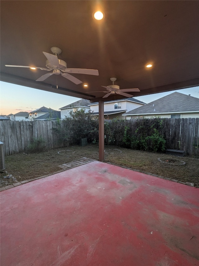 patio terrace at dusk with ceiling fan