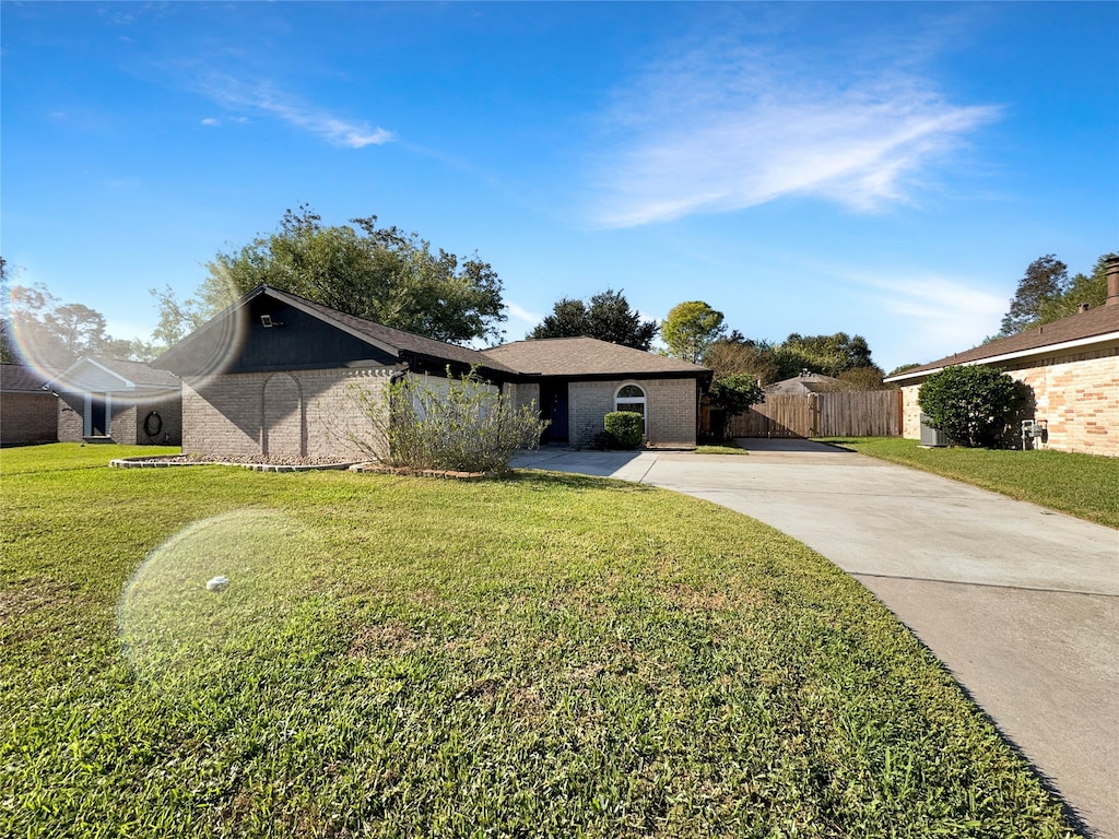 ranch-style house with a front lawn