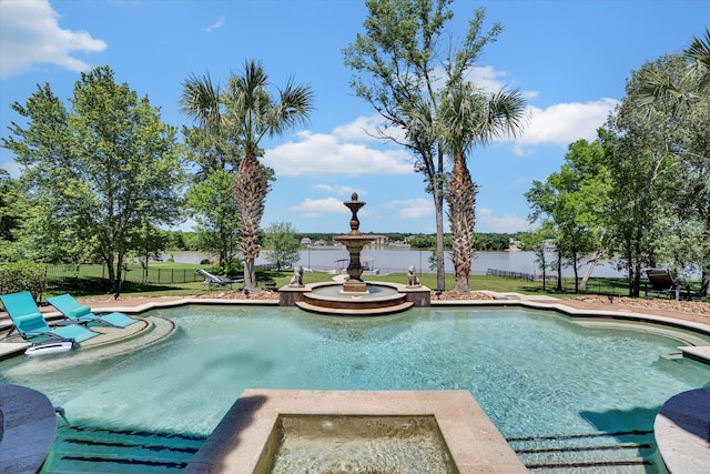 view of swimming pool featuring a water view