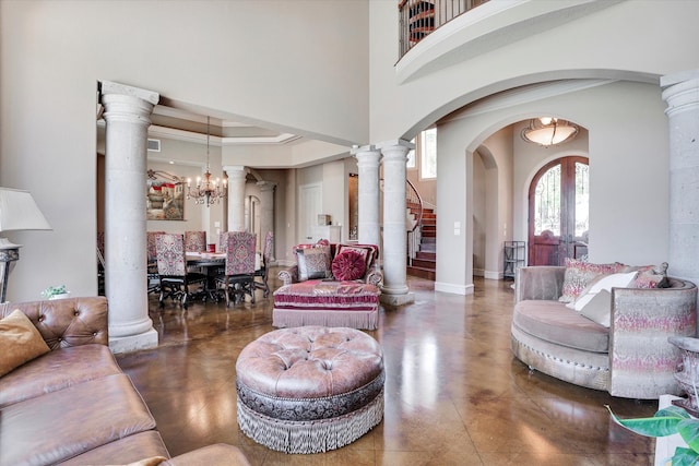 living room featuring a chandelier and ornamental molding