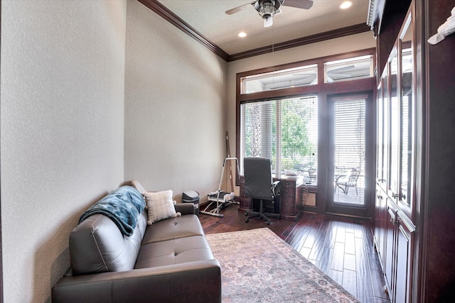 home office featuring dark hardwood / wood-style flooring, ceiling fan, and crown molding