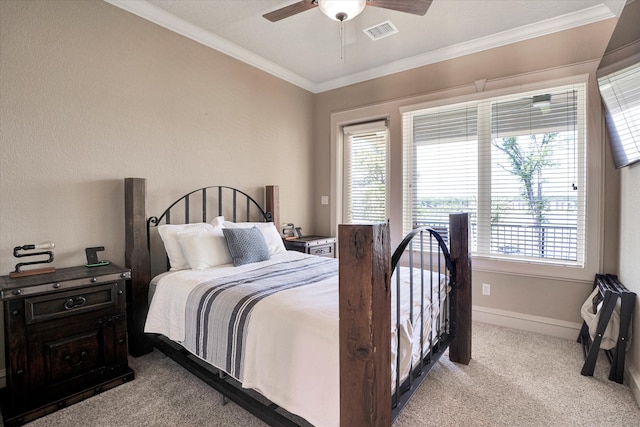 bedroom with multiple windows, light colored carpet, and ceiling fan