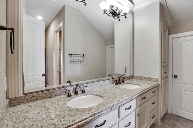 bathroom featuring vanity, a textured ceiling, and tile patterned floors