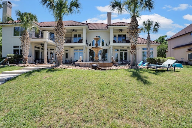 back of house featuring a yard