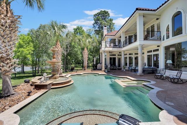 view of swimming pool featuring a patio area