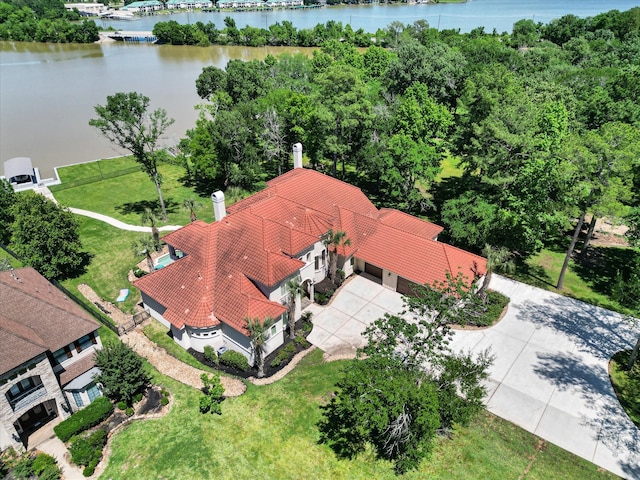 birds eye view of property with a water view