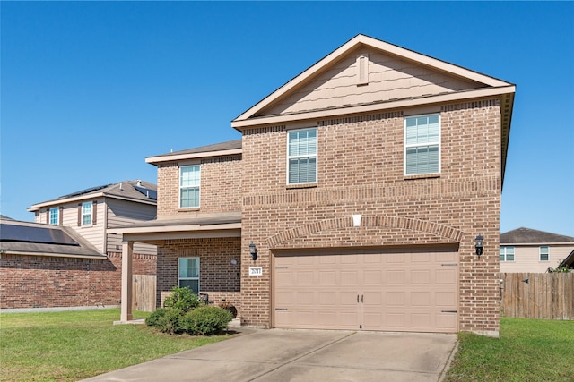 traditional home with brick siding, concrete driveway, fence, a garage, and a front lawn