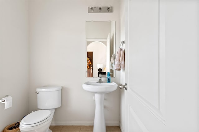 2011 Beach Bluff Rd, Rosenberg, TX 77469 - bathroom with toilet, tile patterned floors, and baseboards