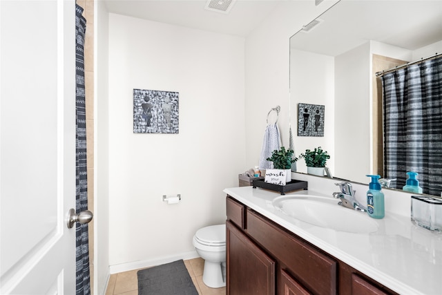 bathroom with visible vents, baseboards, toilet, tile patterned flooring, and vanity