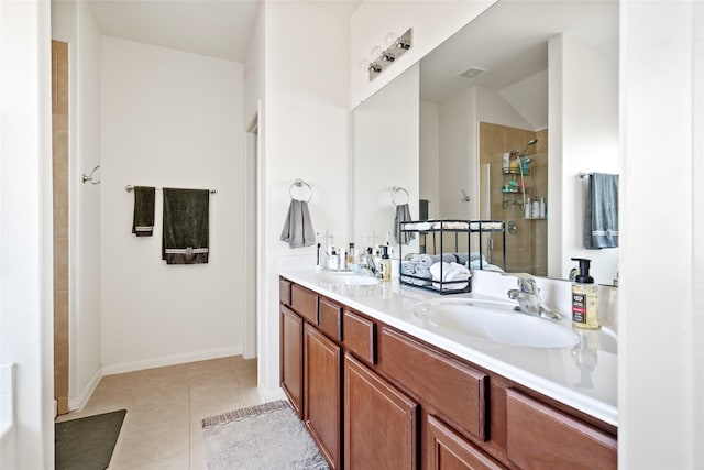 2011 Beach Bluff Rd, Rosenberg, TX 77469 - full bath featuring double vanity, a tile shower, tile patterned floors, and baseboards