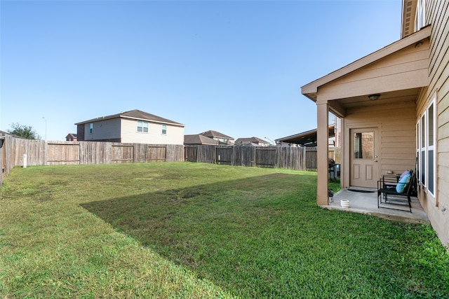 view of yard featuring a patio area and a fenced backyard