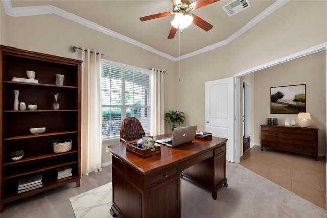 tiled office featuring ceiling fan, vaulted ceiling, and ornamental molding