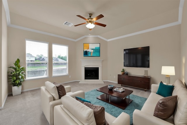 carpeted living room with ornamental molding, ceiling fan, and vaulted ceiling