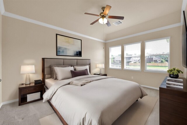 bedroom with ceiling fan, light carpet, and crown molding