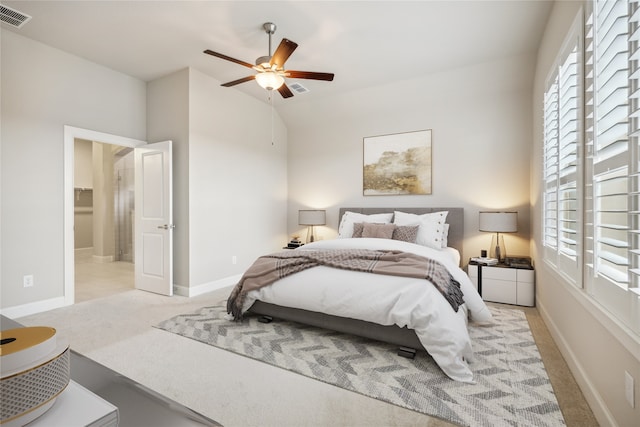 carpeted bedroom featuring ceiling fan and lofted ceiling