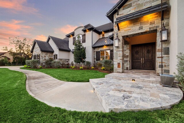 view of front of house with a lawn