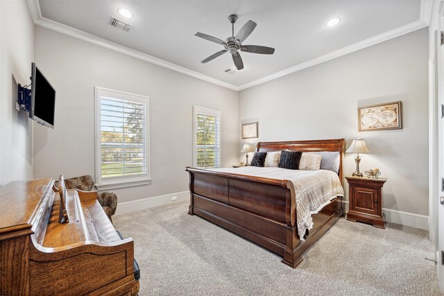 bedroom with light carpet, ceiling fan, and crown molding