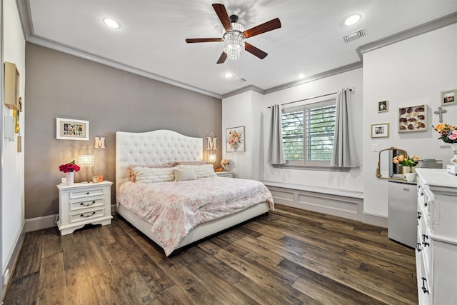 bedroom featuring dark wood-style flooring, crown molding, recessed lighting, visible vents, and stainless steel refrigerator