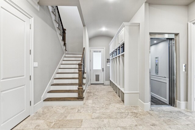 mudroom with vaulted ceiling