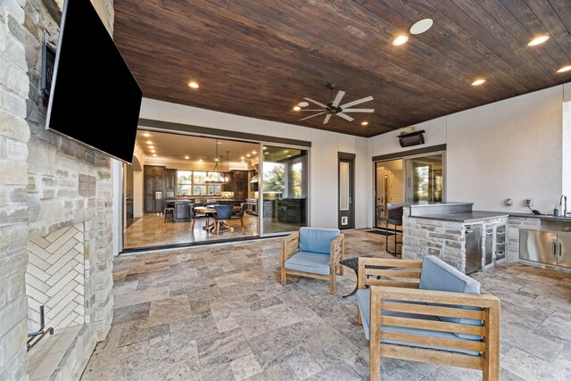 view of patio / terrace with area for grilling and ceiling fan