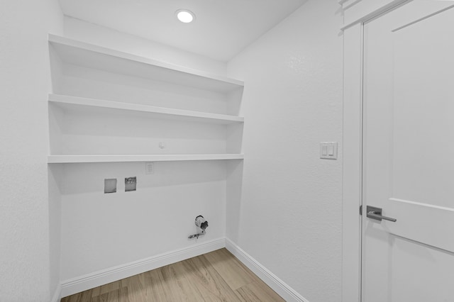 washroom featuring washer hookup and light hardwood / wood-style floors