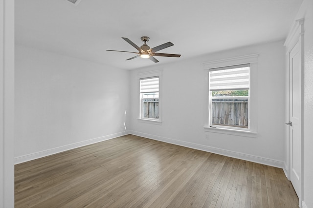 unfurnished room featuring light wood-type flooring and ceiling fan