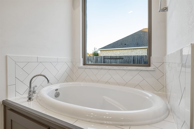 bathroom featuring a tub to relax in