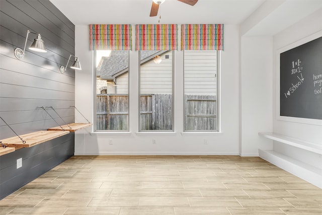 interior space with ceiling fan and light wood-type flooring