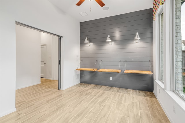 interior space featuring ceiling fan and light wood-type flooring