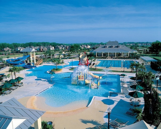 view of swimming pool with a water slide