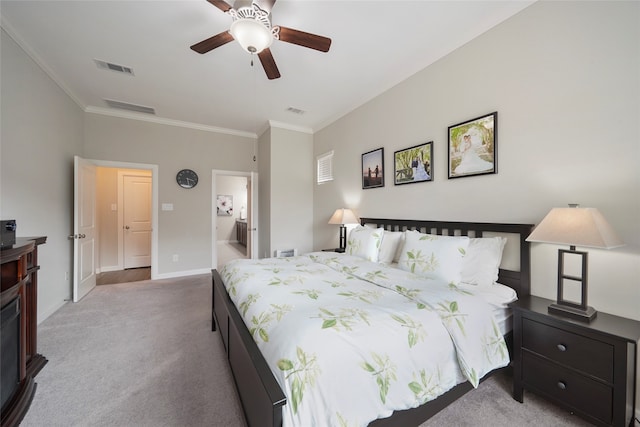 carpeted bedroom featuring connected bathroom, ceiling fan, and ornamental molding