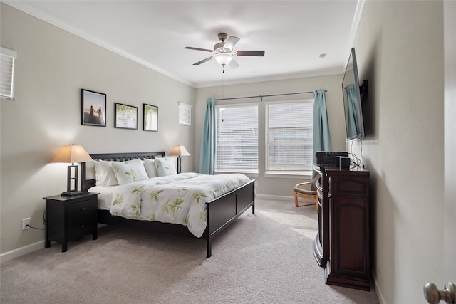 carpeted bedroom with ceiling fan and crown molding